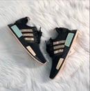 Image of Adidas NMD R1 Women's Sneaker Core Black/Gold Metallic/Halo Amber customized with Swarovski Crystals