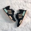 Image of Adidas NMD R1 Women's Sneaker Core Black/Gold Metallic/Halo Amber customized with Swarovski Crystals