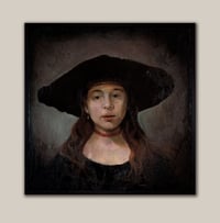 Image 1 of Young woman with a black hat