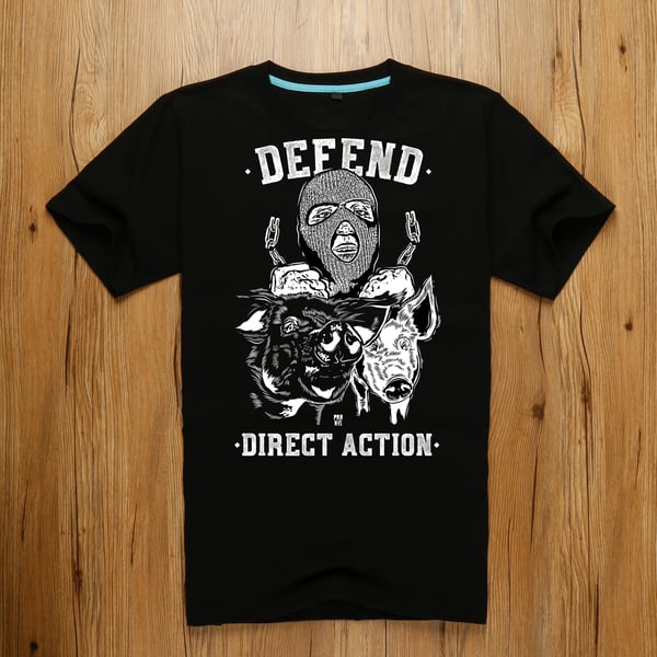 Image of T-shirt « DEFEND DIRECT ACTION » - designed by the street artist Praxis