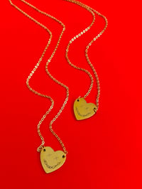 Image 1 of BARBED WIRE SMILEY ENGRAVED HEART NECKLACE 