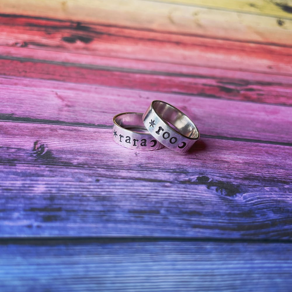 Personalised silver name ring with star and moon. Celestial silver 925 stamped word ring.