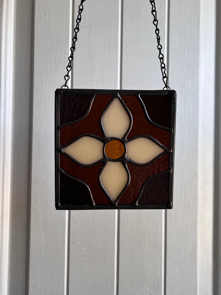 Image of Dark amber flower tile