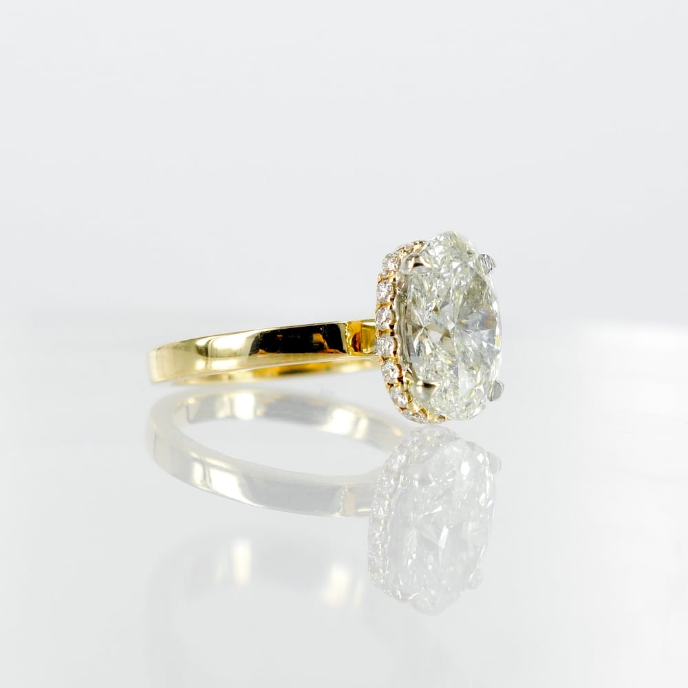 Image of 18ct yellow gold halo oval diamond engagement ring. Pj5685