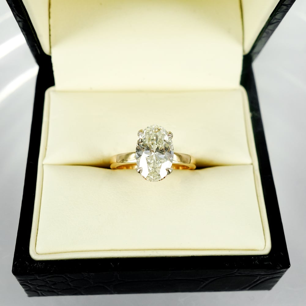 Image of 18ct yellow gold halo oval diamond engagement ring. Pj5685