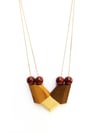 SYMETRIC WOODEN NECKLACE _ BURGUNDY PEARLS