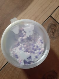 Small container of crunchy unicorn barf slime