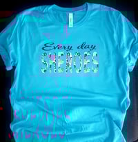 Image 12 of Statement tees