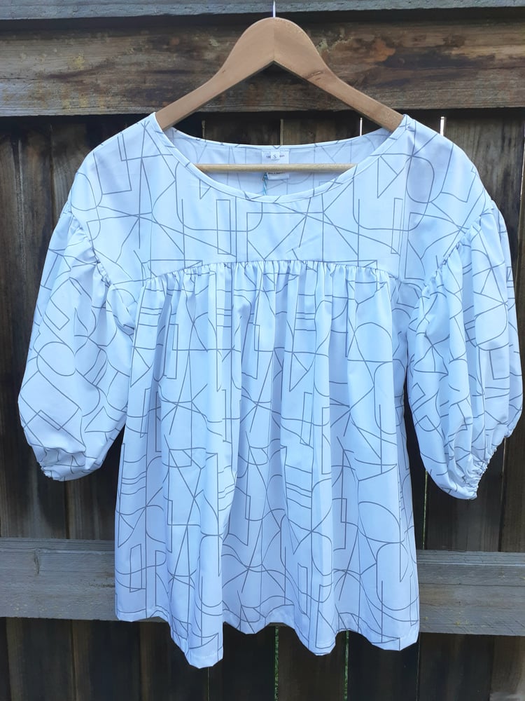Image of BONNIE SMOCK TOP in Alphabet. Available in SMALL.