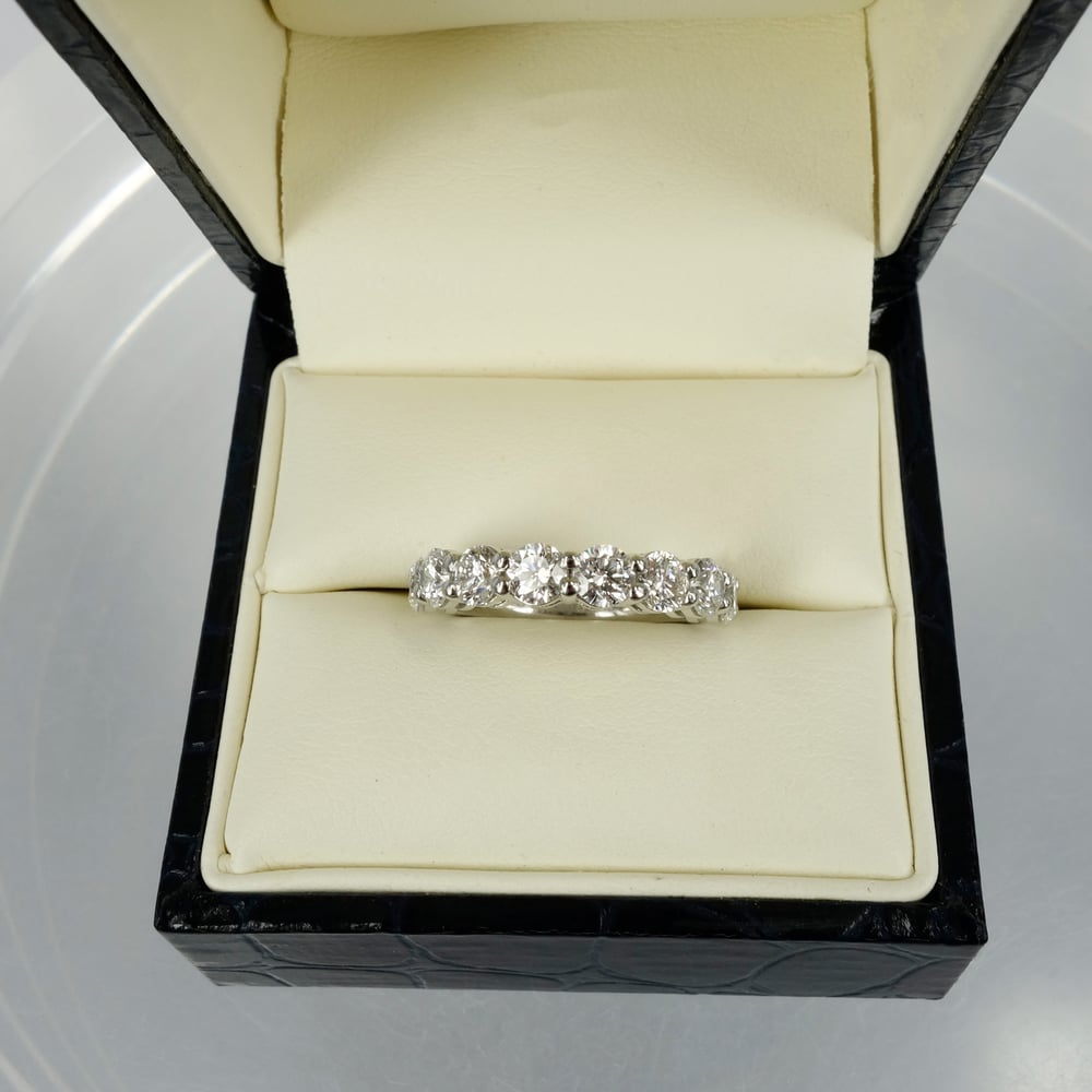 Image of 18ct white gold shared claw diamond set eternity ring.Pj5738