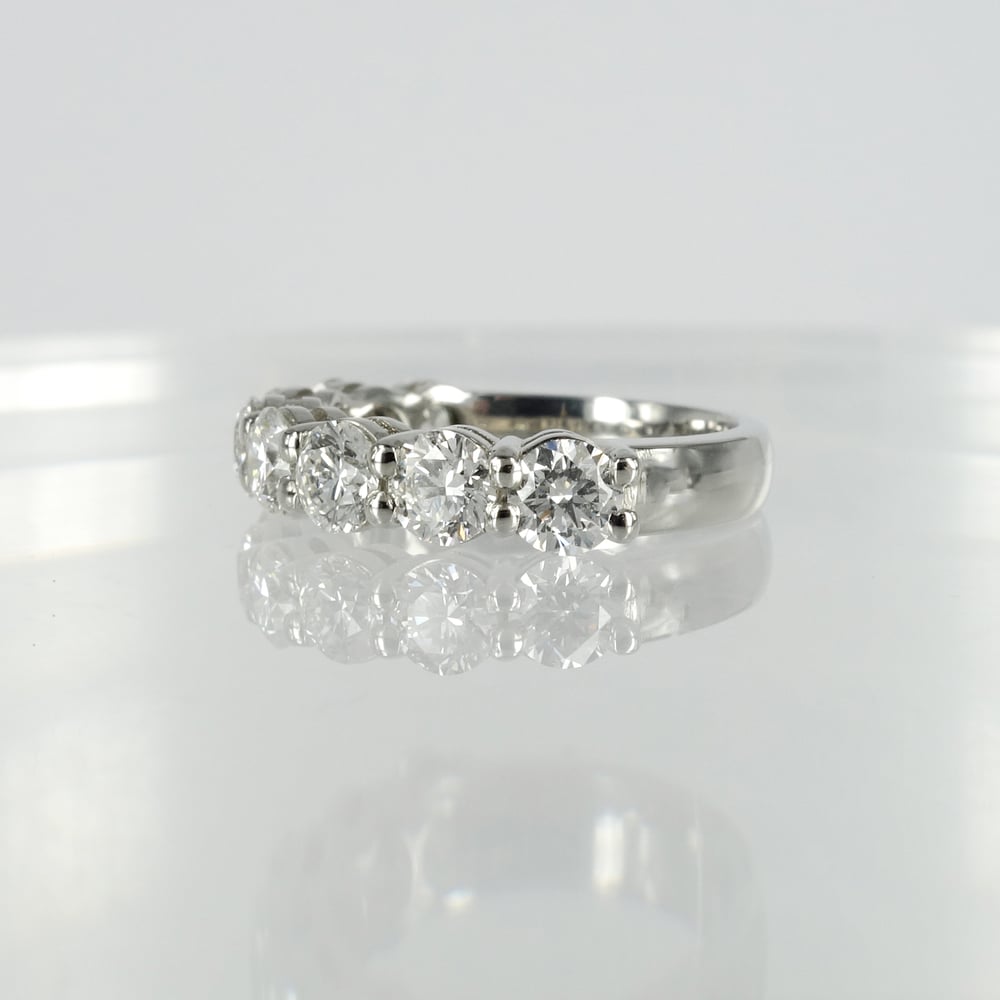 Image of 18ct white gold shared claw diamond set eternity ring.Pj5738