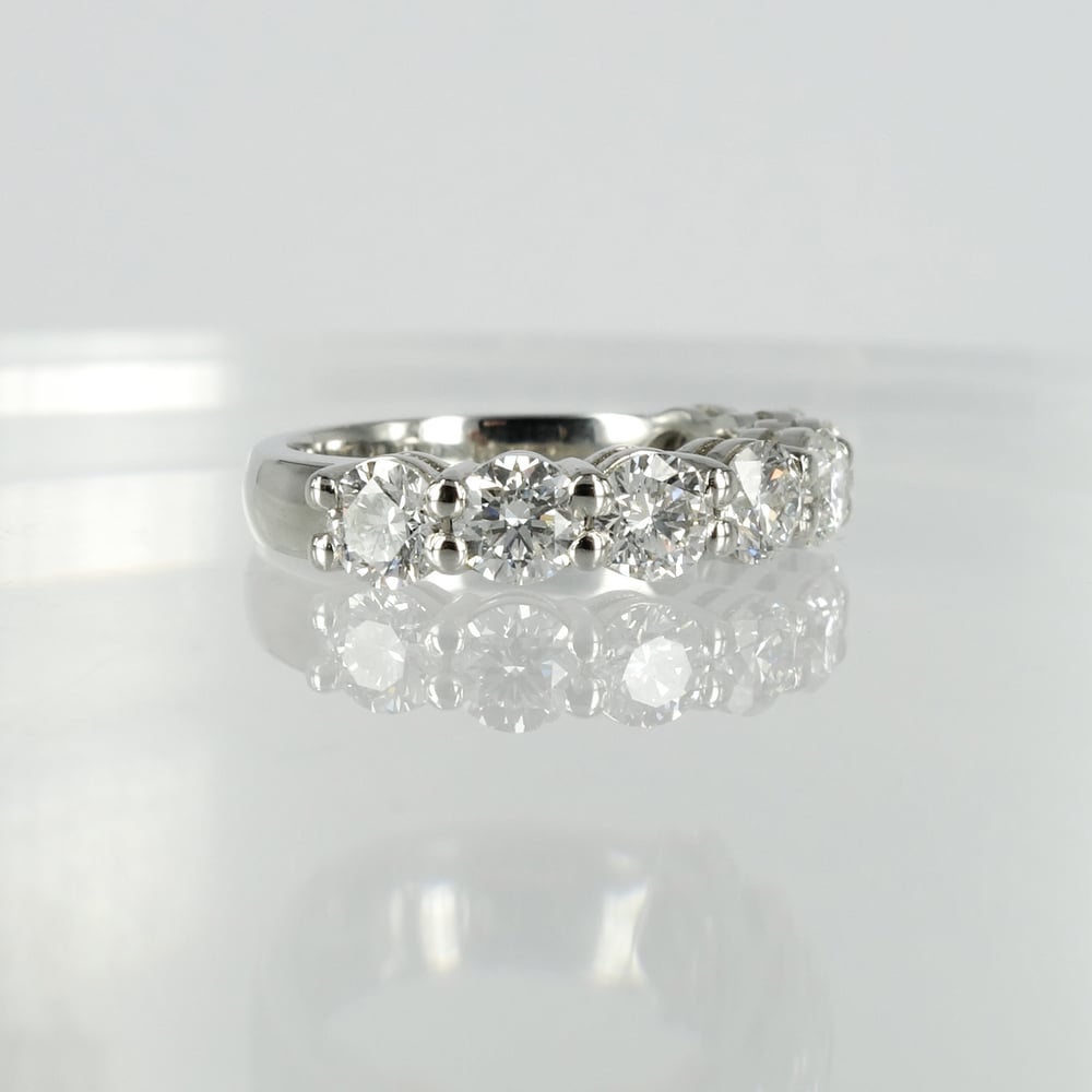 Image of 18ct white gold shared claw diamond set eternity ring.Pj5738