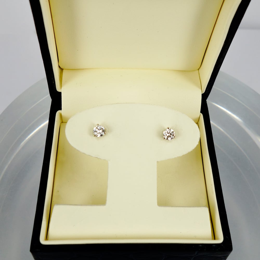 Image of 14ct white gold diamond studs.Set with  2 Diamonds  = .50ct FSI2 total weight. Pj5863