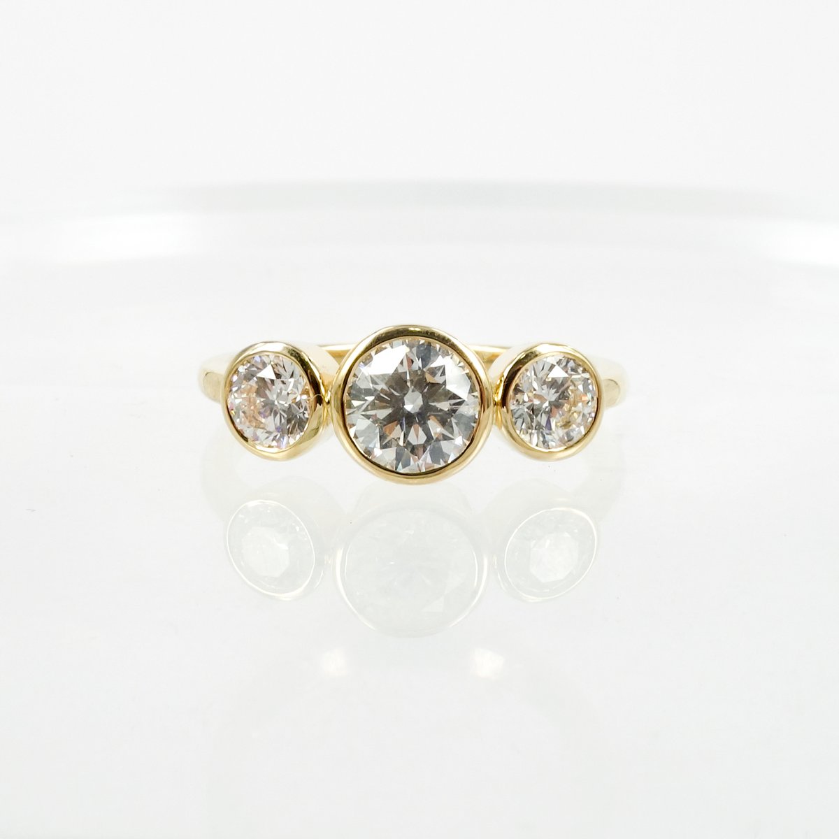 18ct yellow gold bezel set trilogy ring. PJ5790 / Pilkington Jewellers