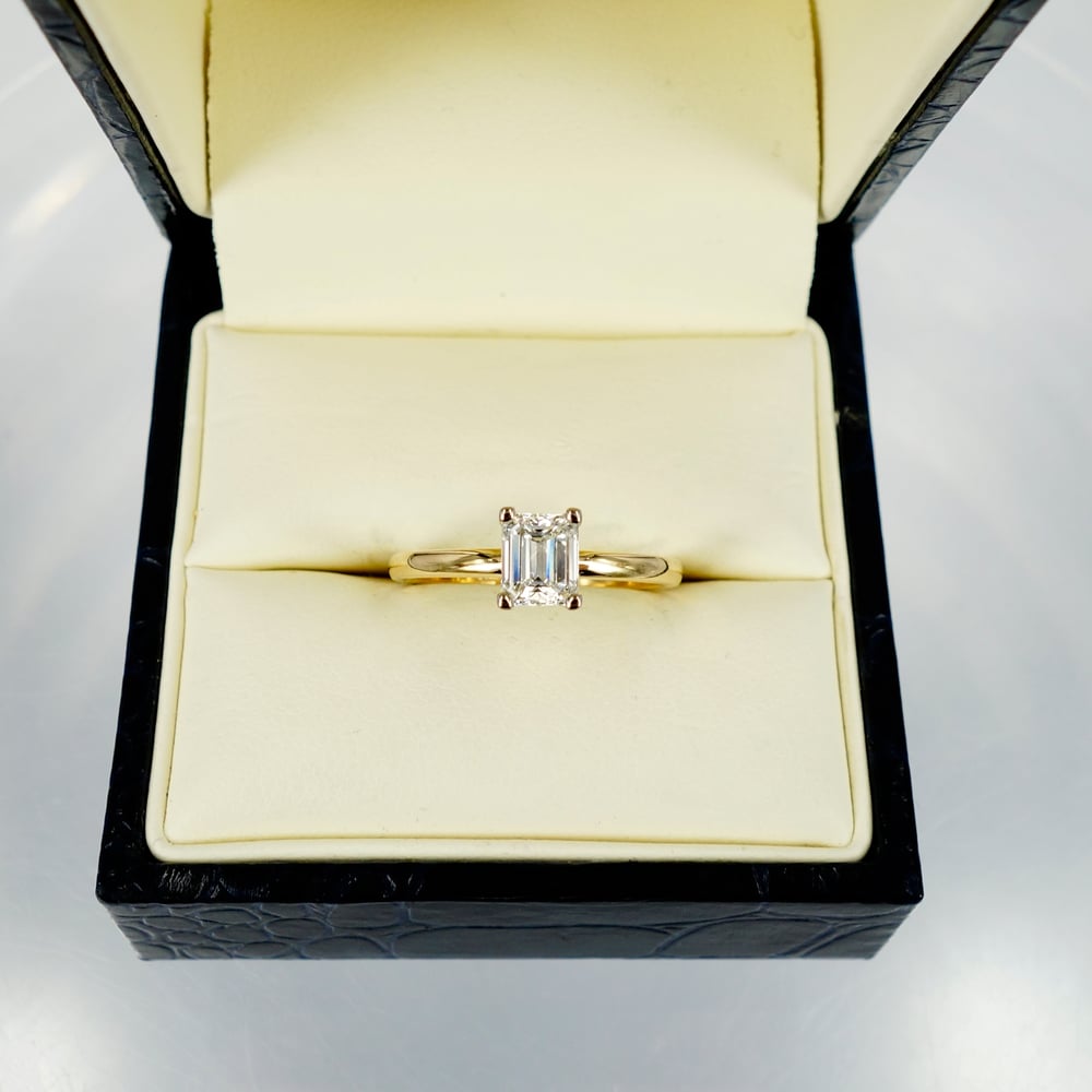 Image of 18ct yellow gold 1ct Asscher cut diamond solitaire ring.