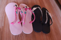 Pink and black flip flop 