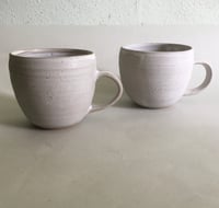 Washed  white stoneware mugs 
