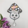 Iridescent Peach Ms. Mushie Suncatcher