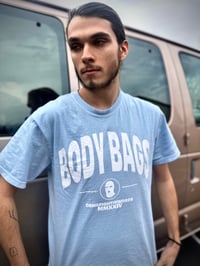 Image 1 of ‘Body Bags’ Light Blue Tee