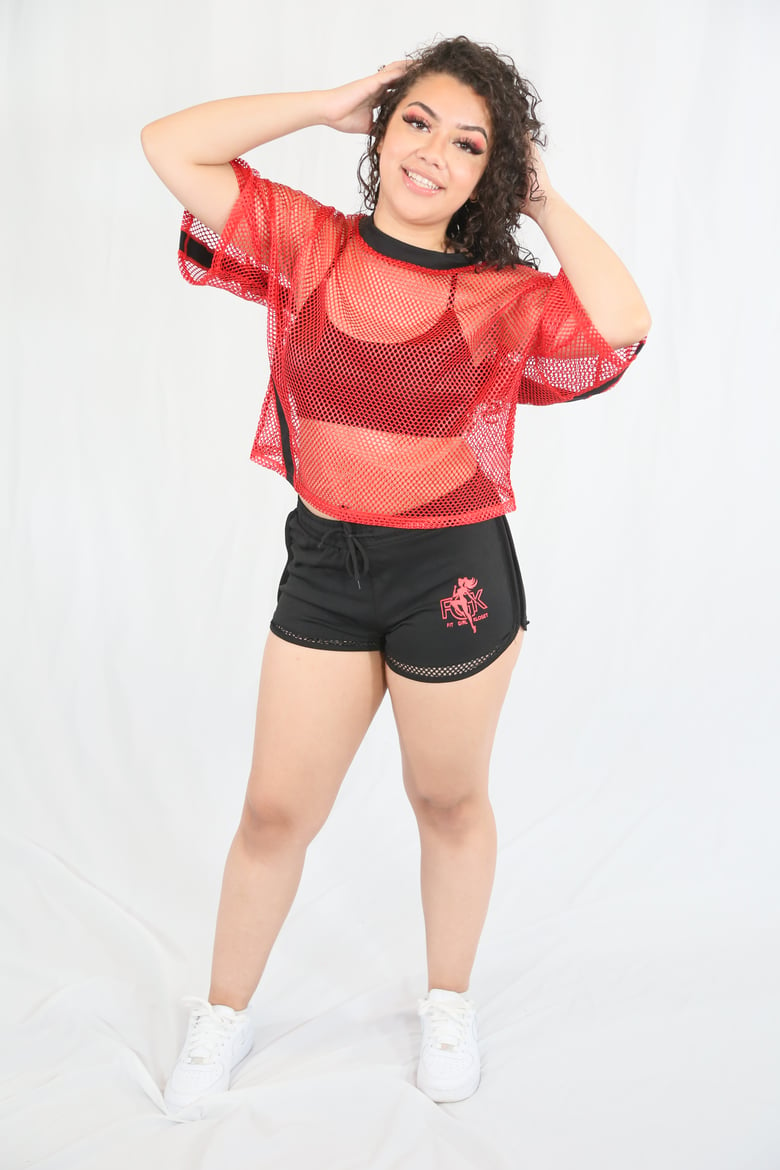 Image of Red mesh top with black logo shorts