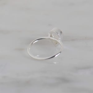 Image of Rainbow Moonstone pear shape cabochon cut classic silver ring