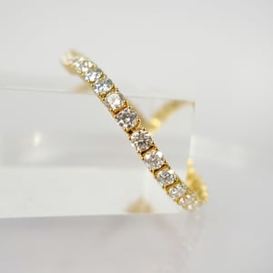 Image of 18ct yellow gold tennis bracelet set with .14pt E-F lab grown diamonds.. TB4