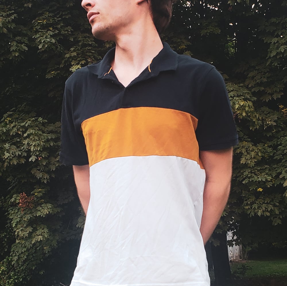 Image of Orange, white, and black Polo Tee