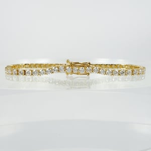 Image of 18ct yellow gold tennis bracelet set with 8.6pt E-F VS lab grown diamonds. TB5