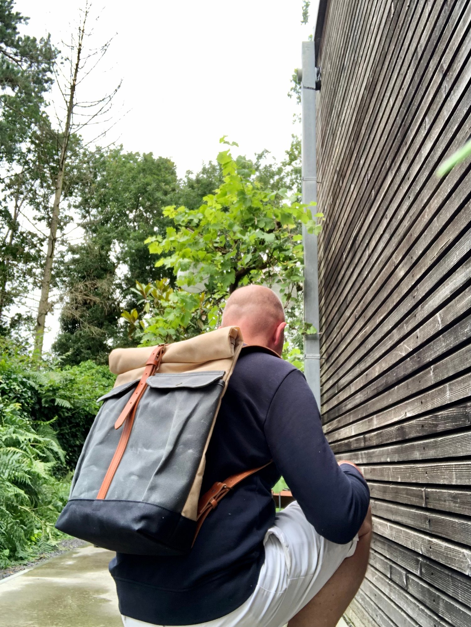 Image of Waxed canvas rucksack with roll to close top and vegetable tanned leather shoulder straps