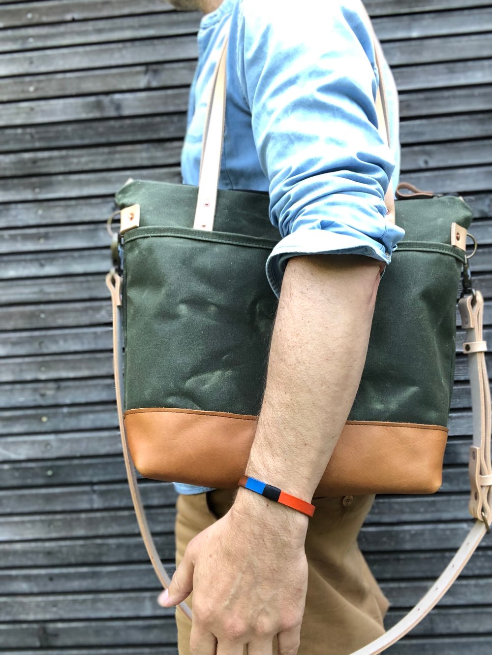 Waxed canvas leather tote bag in olive green with zipper closure and cross  body strap