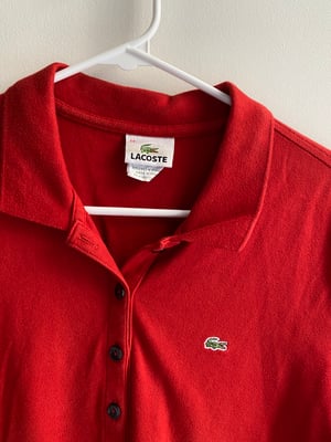 red Lacoste polo