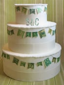Image of Green Vintage Stamp Wedding Cake Garland