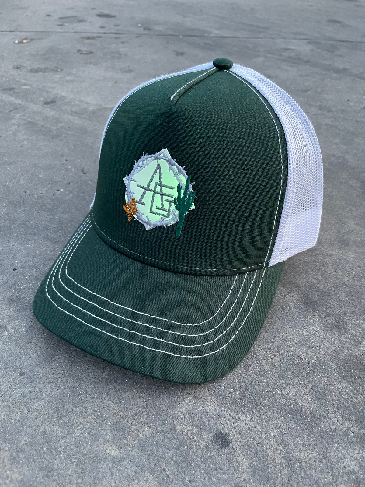 Image of Glow in the dark green bottle cactus trucker hat