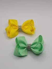 Image 1 of Green and Yellow Bows