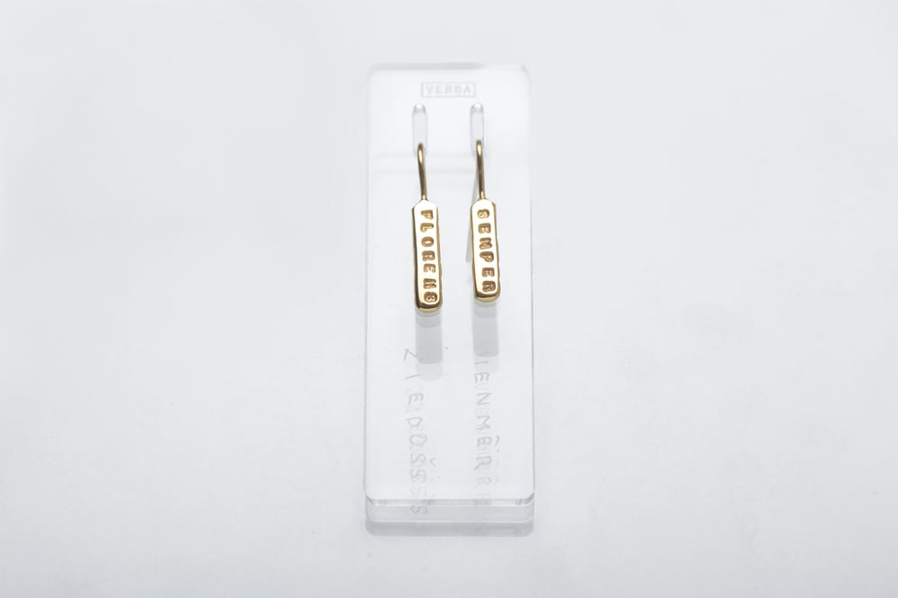 Image of gold plated light plain silver earrings with inscription in Latin