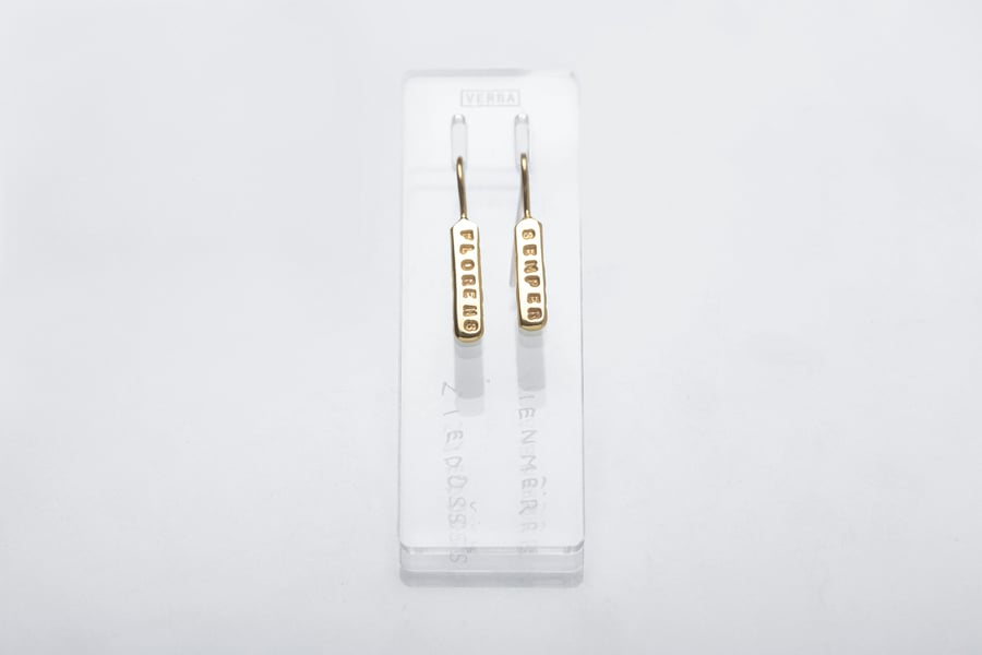 Image of gold plated light plain silver earrings with inscription in Latin