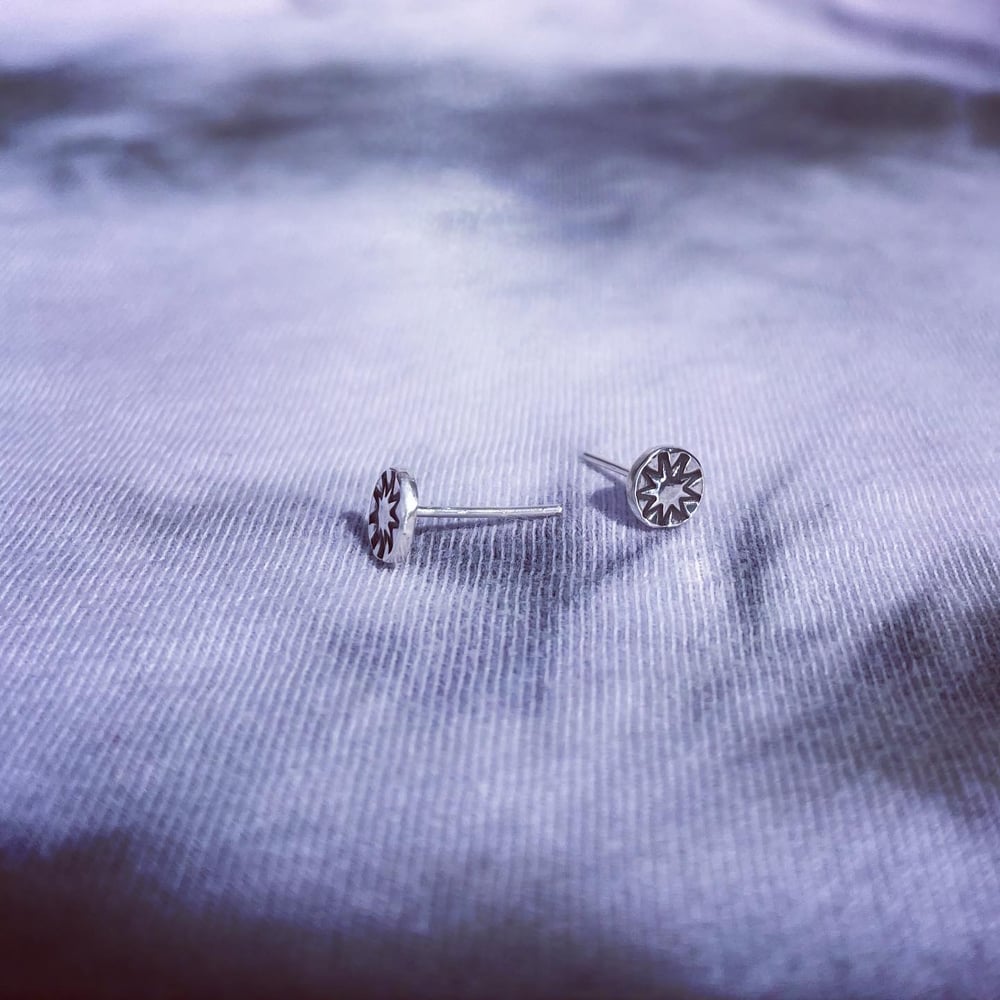 Handmade sterling silver nine point star stud earrings