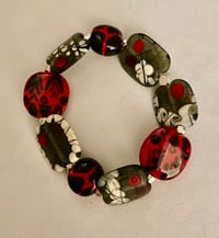 Image 1 of Red, black & silver bracelet