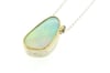 White opal and spinel set in 18ct gold and sterling silver