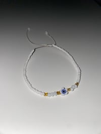 Image 1 of White/ Blue flower Evil eye bracelet 