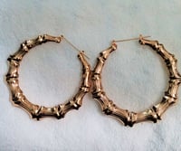 Image 1 of Large Gold Toned Bamboo Hoop Shaped Earrings