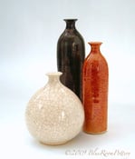 Image of Group of three Luster bottles