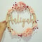 Image of Bamboo name wreath with preserved florals 