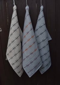Barbed wire tea towel in linen