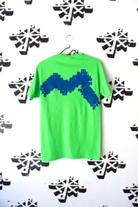 Image of glitch in the system tee in green 