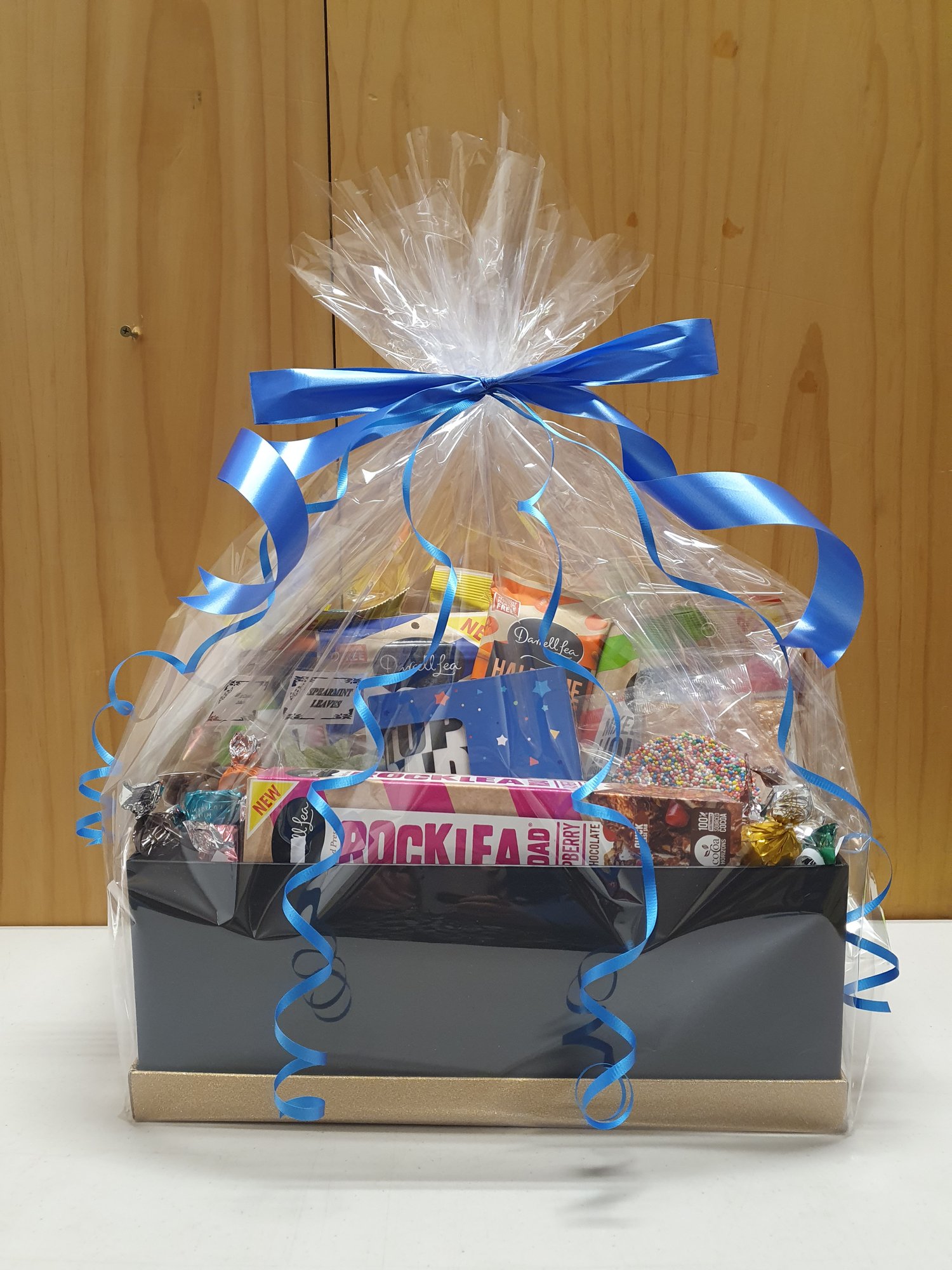 Image of Hamper Basket Gift wrapped in Cellophane and Ribbon