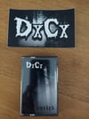 DxCx: Buried cassette & sticker
