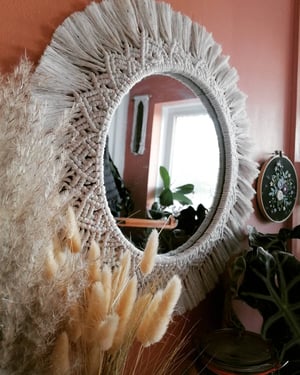 Macramé mandala mirror in rainbow dust