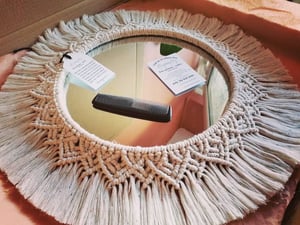 Macramé mandala mirror in rainbow dust