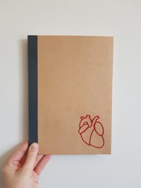 Suture embroidered notebook